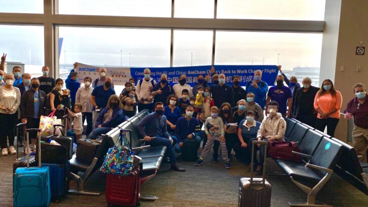 Passengers in airport with banner-1